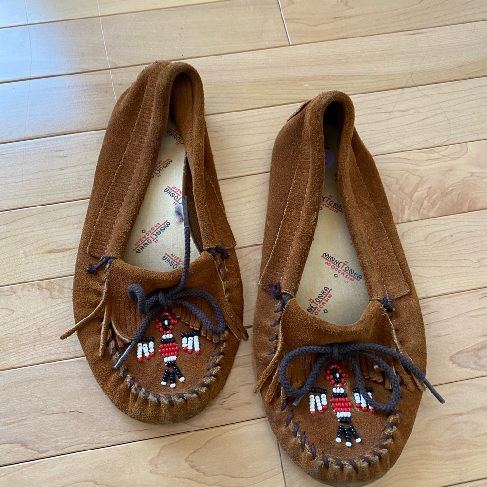 Minnetonka moccasins. Well loved but still comfortable and cute.